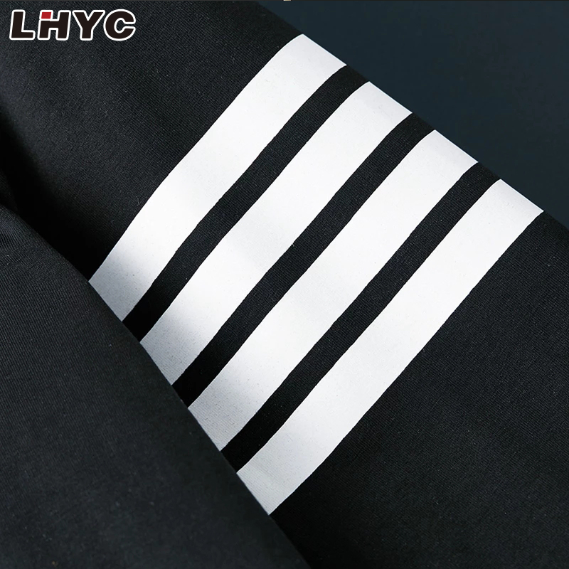 工厂生产的长袖白色和黑色剥离 100% 棉 T 恤，适合休闲装